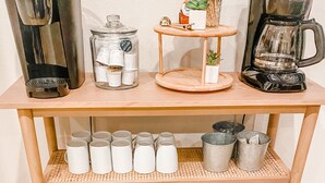 A wooden coffee station with multiple coffee makers, a glass jar, and a small plant. - ☀️HUGE Beach House!☀️3 blocks to BEACH🏖Ocean View🏝 3 BR/2.5BA (Oceanside)