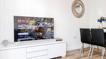 Deluxe Apartment | Living area | LED TV