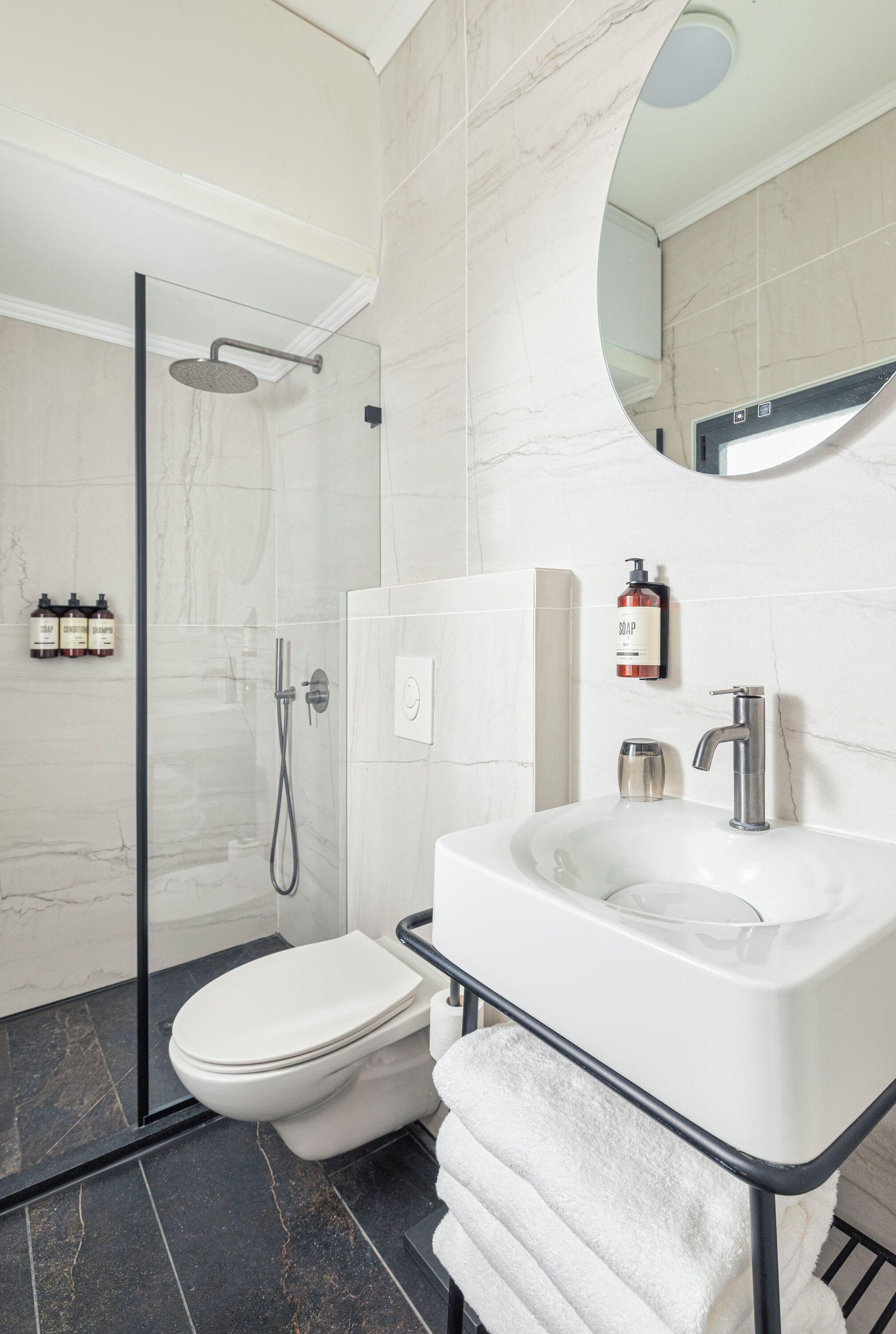 shower, rainfall showerhead, hair dryer, towels