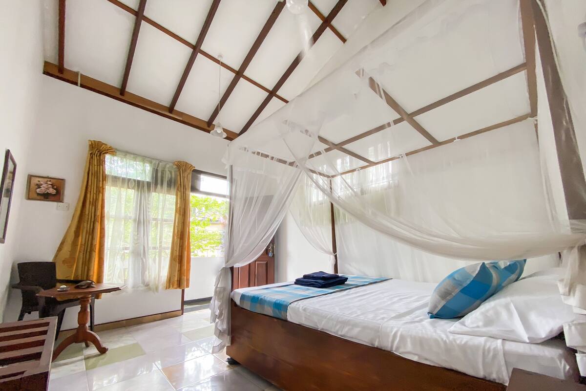 Premium bedding, desk, laptop workspace, blackout curtains