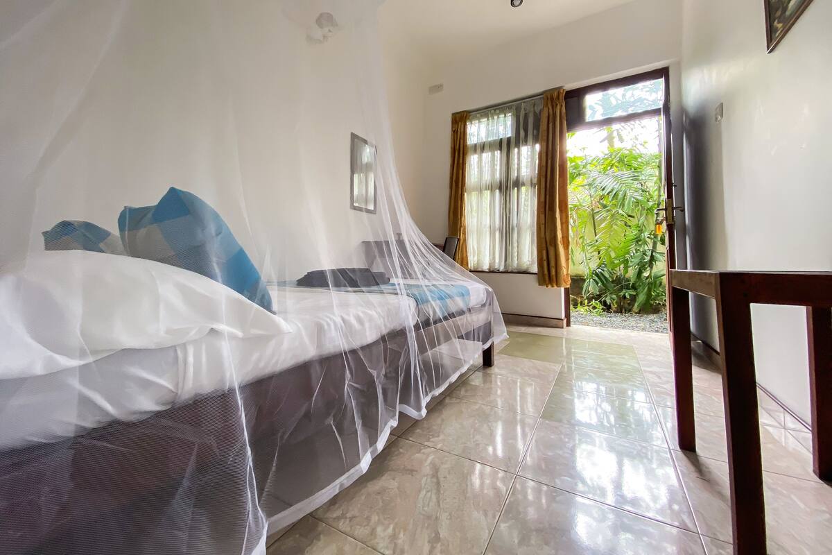 Premium bedding, desk, laptop workspace, blackout curtains