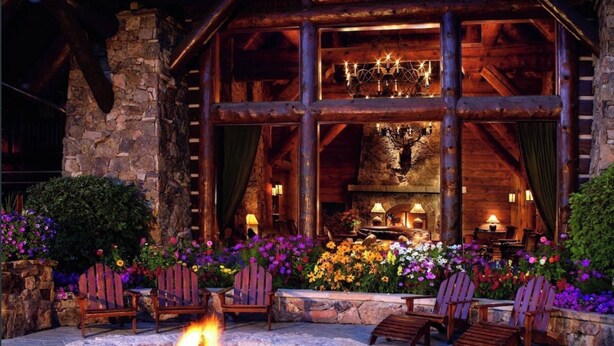 A log cabin with a stone fireplace, outdoor seating, and a fire pit. - SPECIAL! Ritz-Carlton Bachelor Gulch 2BR&2BA Residence INSIDE hotel adj to Lift! (Avon)