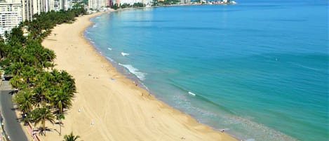 On the beach, sun loungers, beach towels