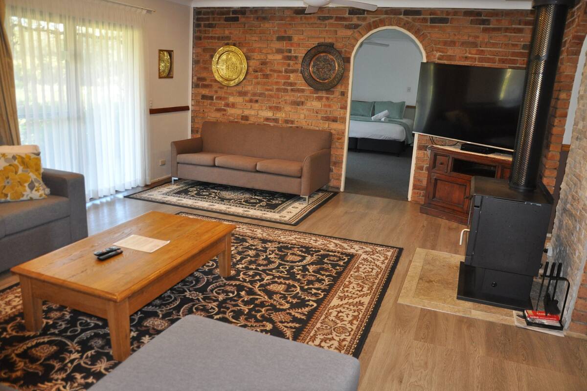 The Homestead (5 King Beds or 12 Single Beds) | Living area | 60-inch LED TV with satellite channels, TV, fireplace