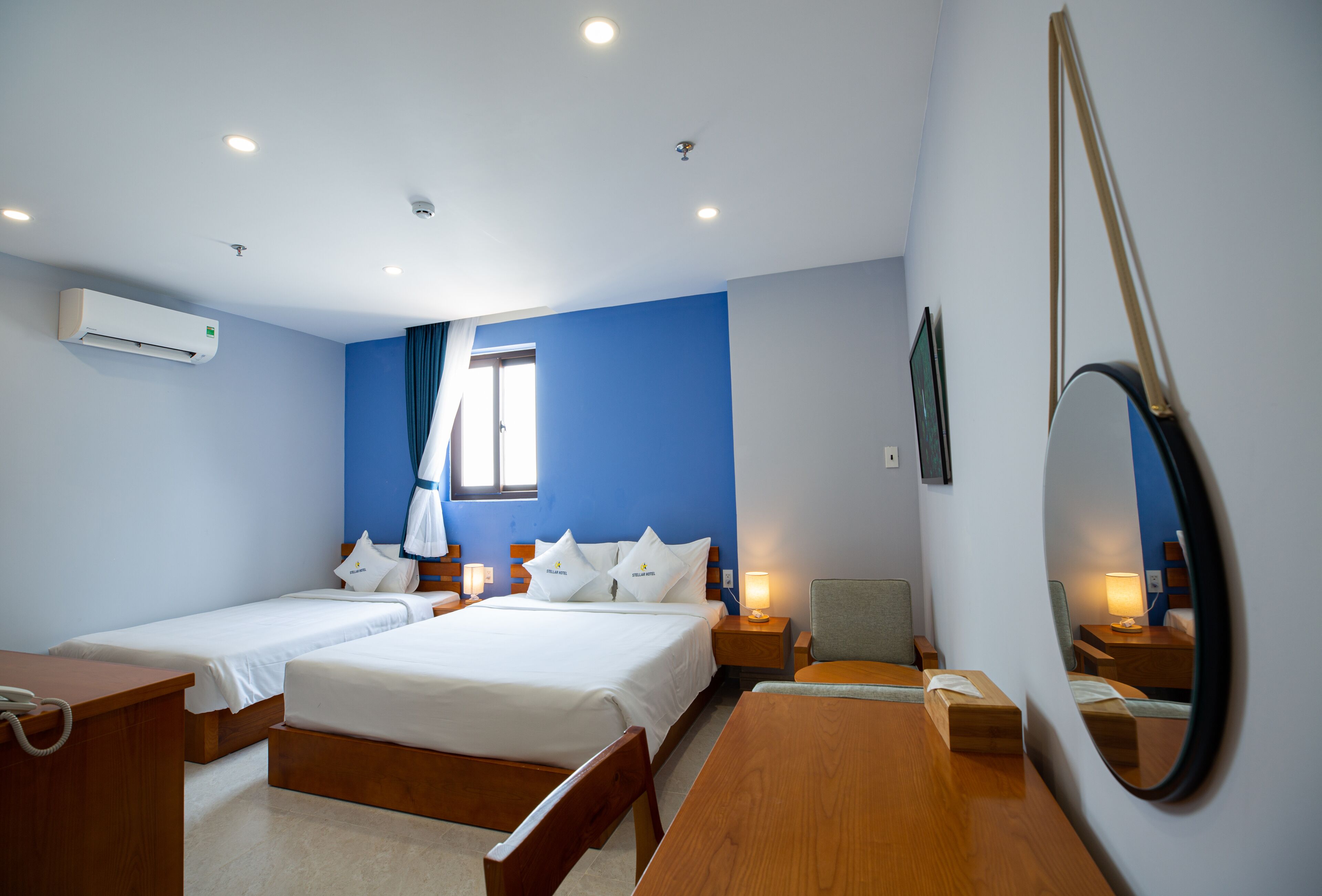 superior triple room | minibar, in-room safe, desk, laptop workspace