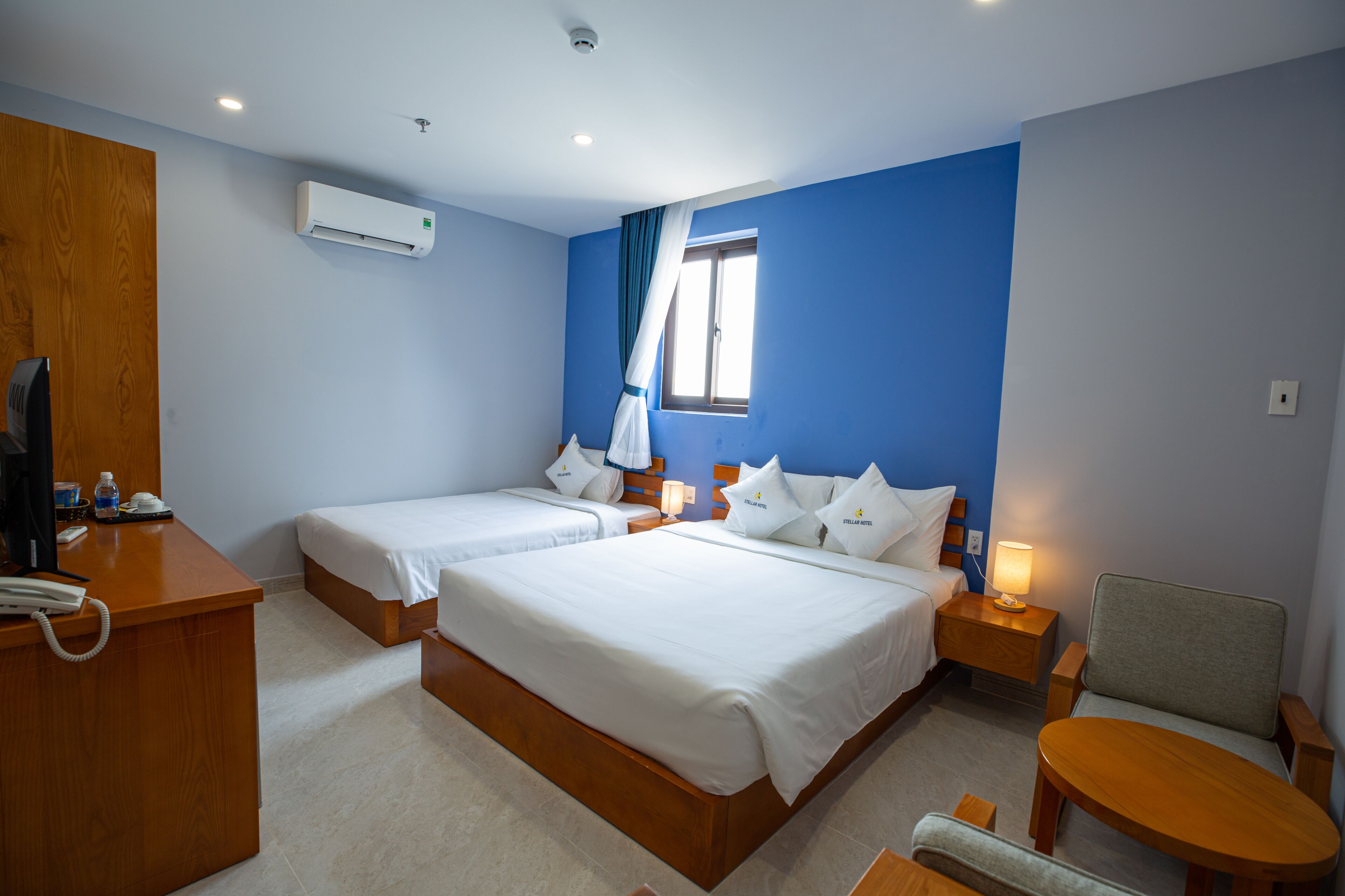 superior triple room | minibar, in-room safe, desk, laptop workspace