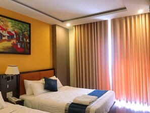 Habitación Deluxe | Ropa de cama de alta calidad y wifi gratis 