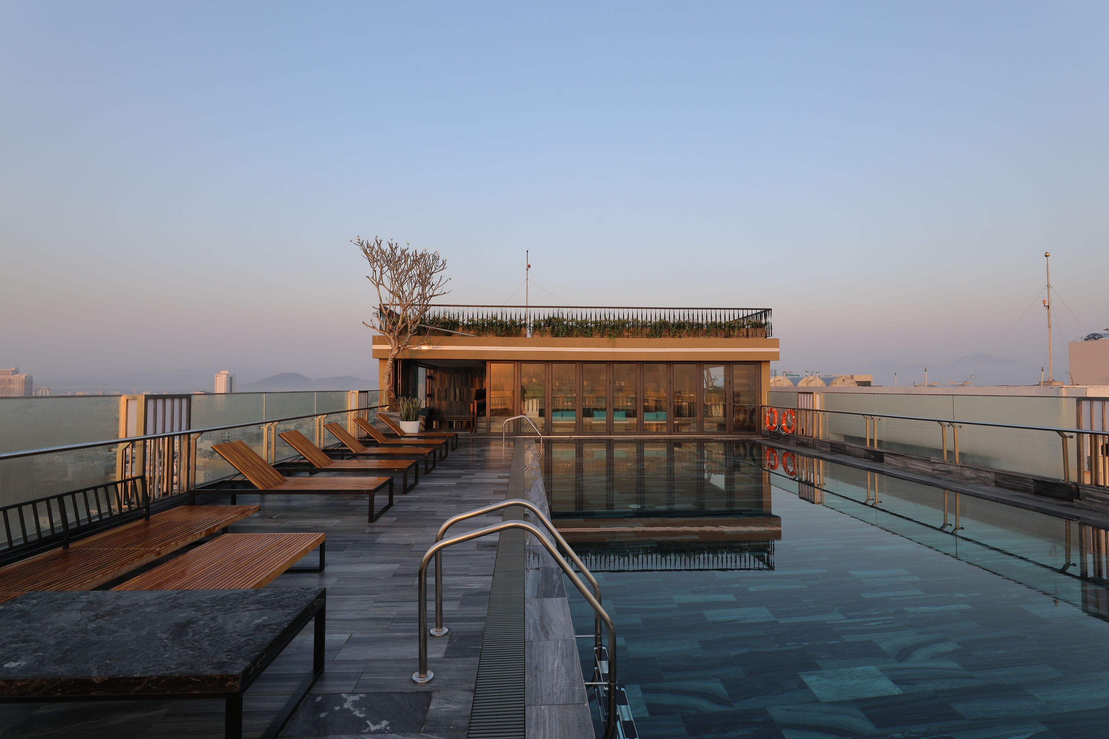 outdoor pool, open 6:00 am to 9:00 pm, pool umbrellas, pool loungers