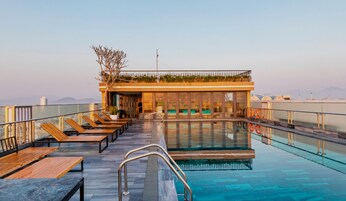 Outdoor pool, open 6:00 AM to 9:00 PM, pool umbrellas, sun loungers