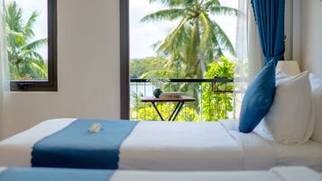 Deluxe Triple Room, River View | Minibar, desk, blackout drapes, iron/ironing board