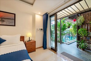 Deluxe Double Room, Pool View | Minibar, desk, blackout drapes, iron/ironing board