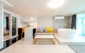 Superior Suite | Living area | Flat-screen TV, heated floors