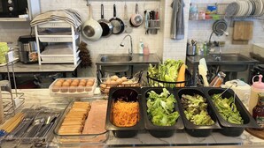 A kitchen with various food items and utensils. - Lemon Siam Hostel Free Breakfast (Bangkok)