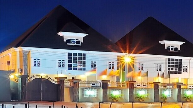A large building with a symmetrical facade, multiple windows, and a prominent entrance. - Brighams Suites (Lagos)
