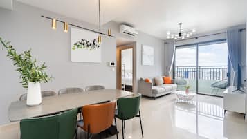 Signature Apartment, 3 Bedrooms, River View | Living area | 43-inch Smart TV with digital channels, TV, Netflix