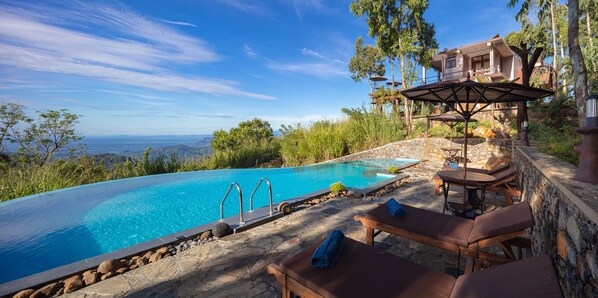 Outdoor pool, pool umbrellas, sun loungers