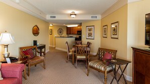 A spacious living room with a dining area, a kitchen in the background, and a television on the right. - Direct oceanfront pools hot tubs downtown Myrtle Beach (Myrtle Beach)