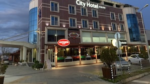 A hotel with a prominent sign for 'City Hotel' and a 'LaZarich Cafe' below it. - City Hotel Plovdiv (Plovdiv)