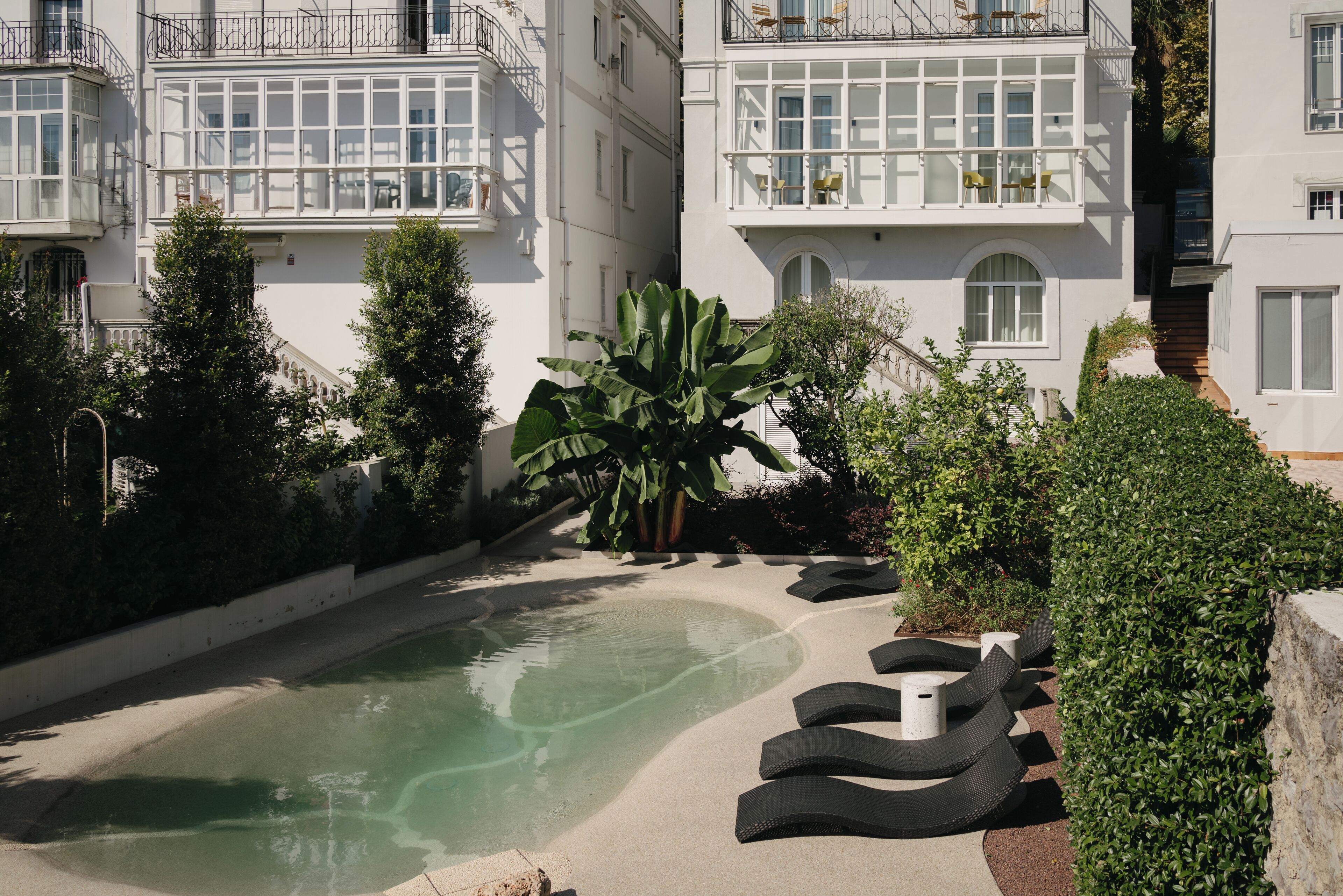 Outdoor pool, open 9:00 AM to 9:00 PM, pool umbrellas, pool loungers