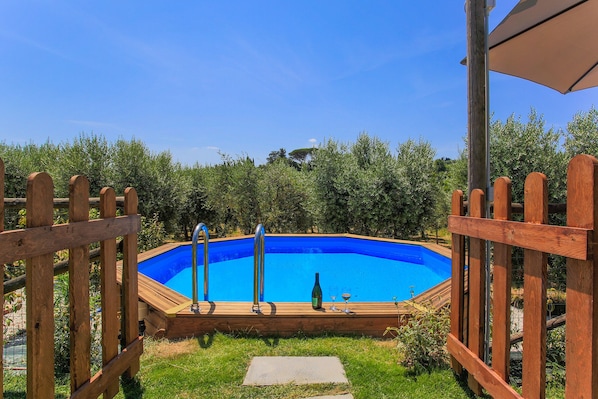 Seasonal outdoor pool, pool umbrellas, pool loungers