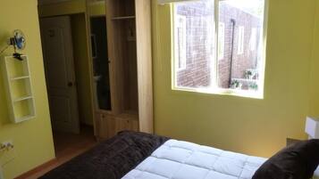 Desk, laptop workspace, blackout curtains, free WiFi