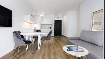 Appartement Confort | Coin séjour | Télévision à écran plat