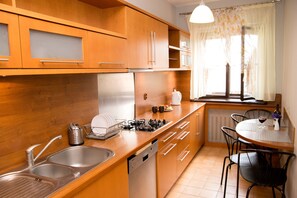Apartment, 3 Bedrooms | Private kitchen | Oven, stovetop, dishwasher, electric kettle - Filin Apartment (Kraków)