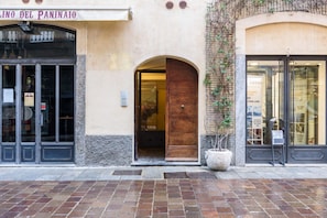 Welcome to LINO DEL PANINATO, a traditional building with a stone facade and a wooden door.