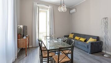 Apartment, 1 Bedroom | Living area | Flat-screen TV