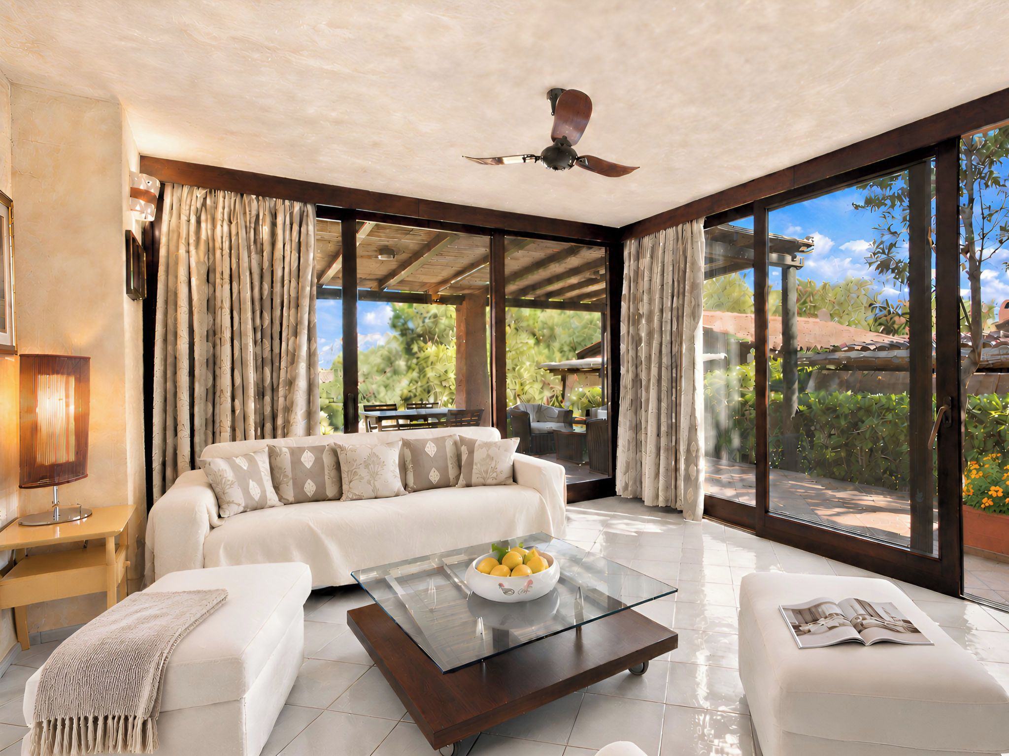A modern living room with a sofa, coffee table, and a ceiling fan.