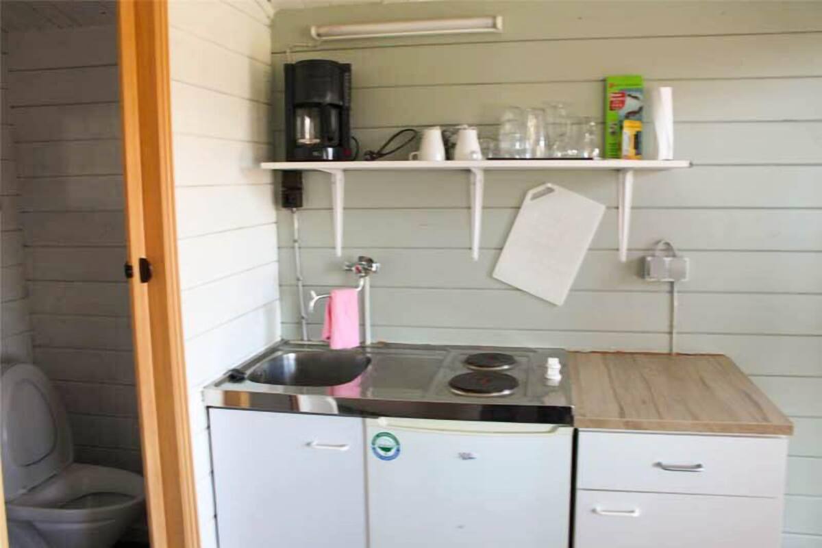 Mini-fridge, stovetop, cookware/dishes/utensils