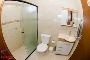 Shower, hair dryer, towels, toilet paper