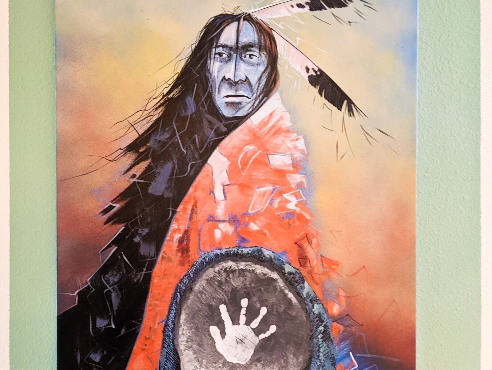 A painting of a person with a handprint symbol on a shield.