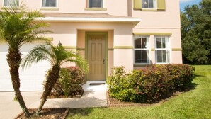 A two-story house with a front door, windows, and a small front yard with plants. - 5 Bed 388 (Davenport)