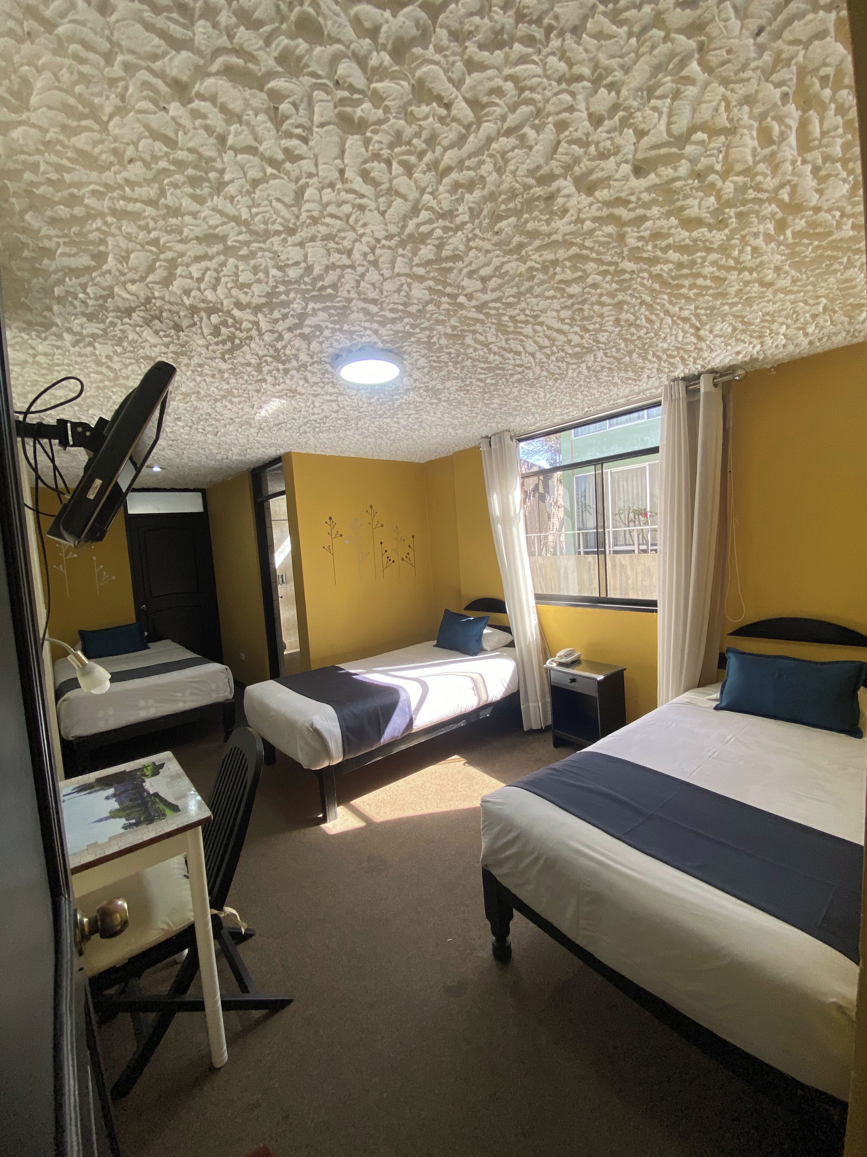 Standard Triple Room | In-room safe, desk, laptop workspace, iron/ironing board