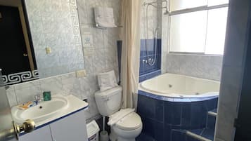 Junior Studio Suite | Bathroom | Hair dryer, towels, soap, shampoo