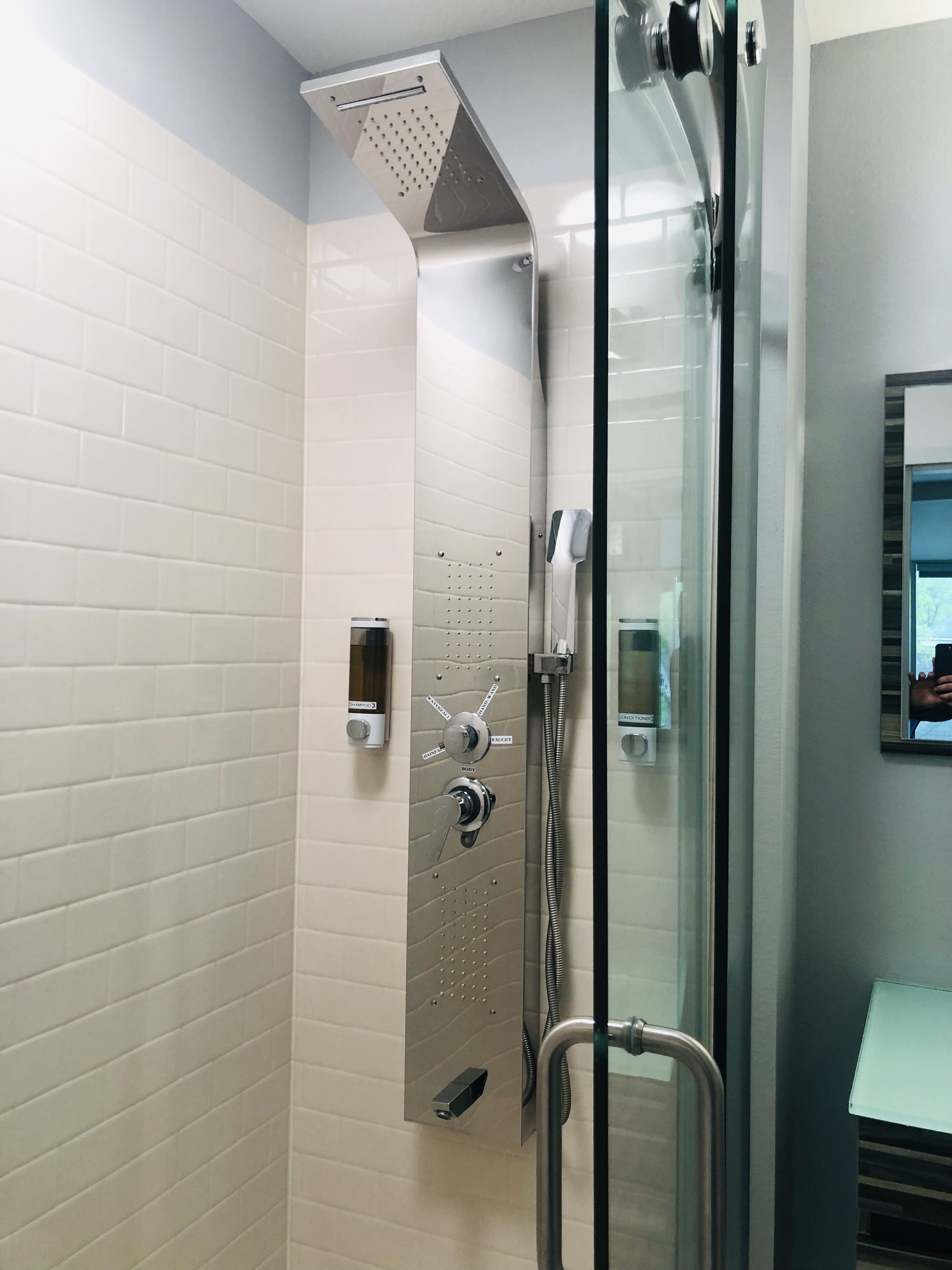 luxurious deluxe king room w/ 65'' tv - complimentary drinks - non-smoking | bathroom | shower, hydromassage showerhead, designer toiletries, hair dryer