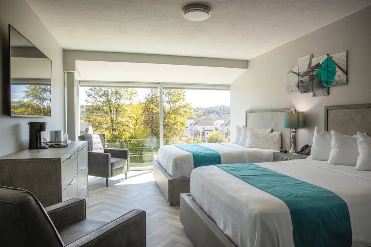 luxurious room w/ two queen beds, 65'' tv, complimentary drinks - non-smoking | egyptian cotton sheets, premium bedding, down duvets, pillow-top beds