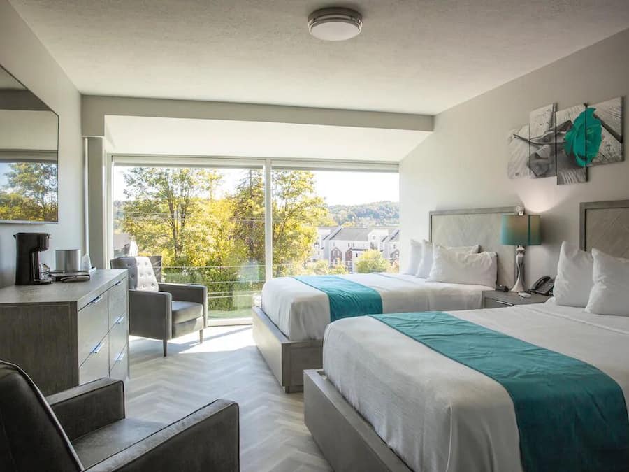 Luxurious Room w/ Two Queen Beds, 65'' TV, Complimentary Drinks - Non-smoking | Egyptian cotton sheets, premium bedding, down comforters, pillowtop beds