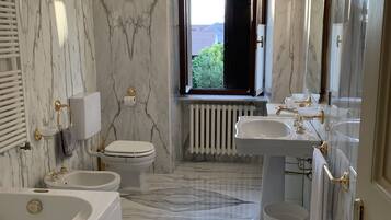Honeymoon Suite | Bathroom | Shower, designer toiletries, hair dryer, bathrobes
