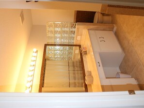 Combined shower/bathtub, hair dryer, towels, toilet paper