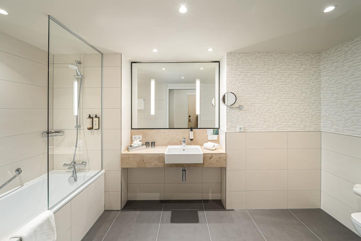 premium room, 1 king bed | bathroom | shower, hair dryer, towels, soap