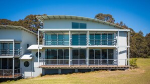 A modern two-story building with large windows and a flat roof. - Bayview Ringlands - Enjoy this relaxing escape (Narooma)