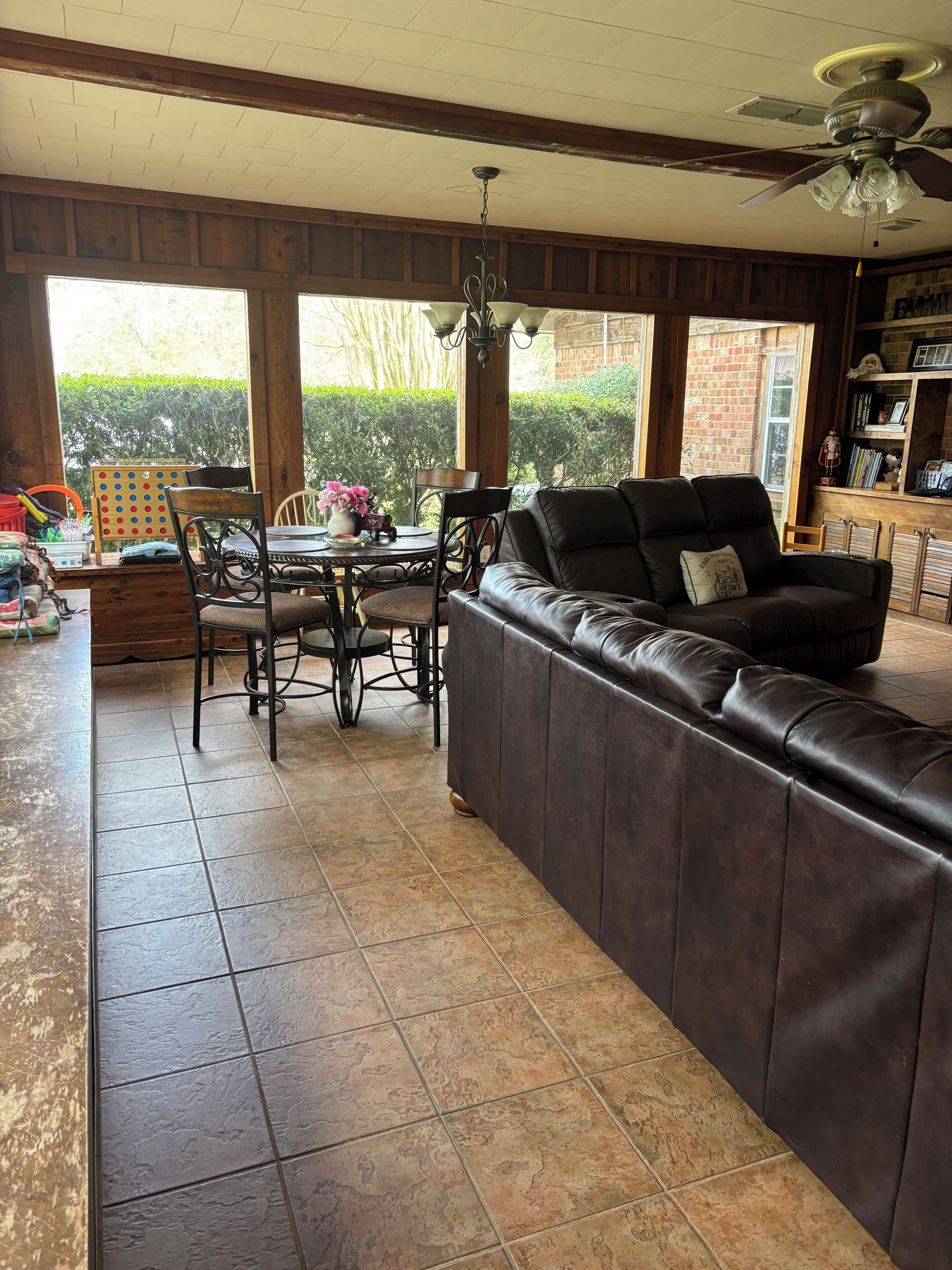 Large living room with huge windows around it.