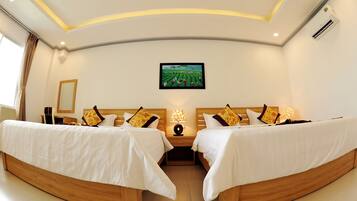 Deluxe Quadruple Room | Premium bedding, minibar, in-room safe, desk