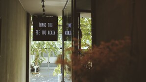 A doorway with a sign that reads "THANK YOU SEE YOU AGAIN." - La Maison Des Delices (Da Nang)