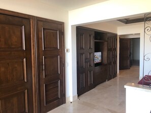 Stylish hallway with rooms and suites, featuring traditional doors and carpeted floors.