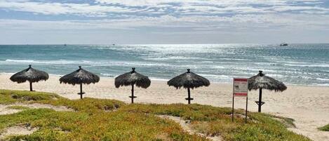 On the beach, sun loungers