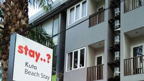 A multi-story building with a sign for 'Kuta Beach Stay'. - Kuta Beach Stay (Kuta)