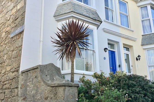 The outside of the house on the corner of Bowling Green.
